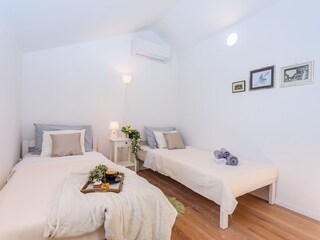 A Bedroom No2 with two single beds 90cm x 200cm, AC