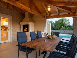 Large covered terrace with fireplace