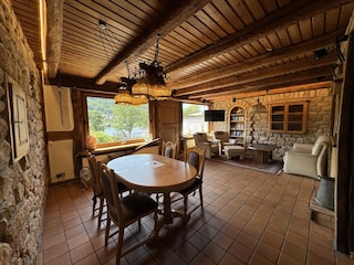 Spacious living room with dining table and leather set