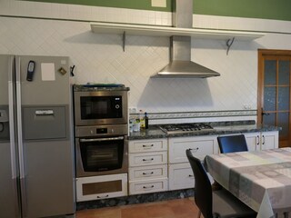 Gas hob, oven, microwave and fridge-freezer