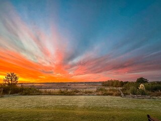 Sonnenaufgang aus dem Panorama Fenster