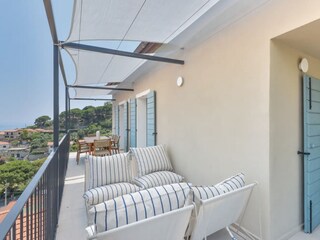 Terrace with table and chairs and lounge corner