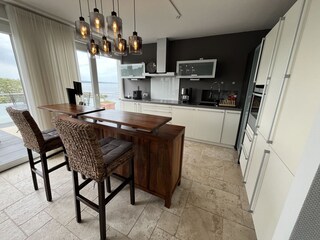 Kitchen with counter and sea view