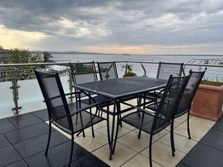 West-facing terrace with seating and beach chair