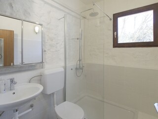 1 of 2 upstairs shower rooms with 1 washing machine.