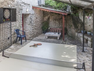 Covered upper terrace. 6m x 10m, ping pong,.