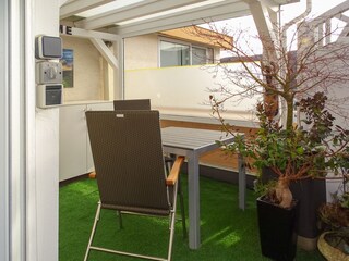 Covered roof terrace