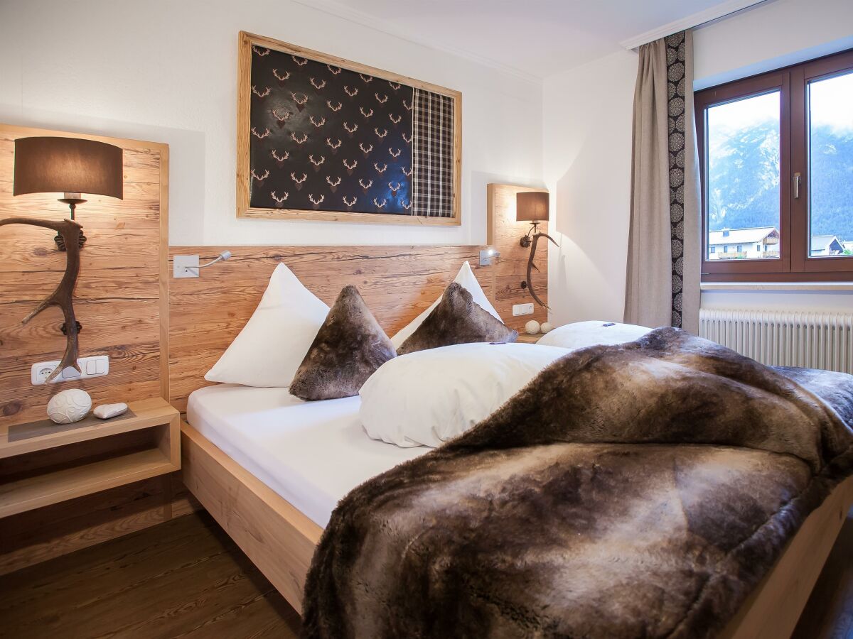 Ferienwohnung Tirol Alpin Schlafzimmer