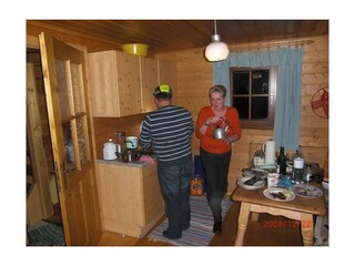 Wohnküche mit Sitzecke und Tischherd