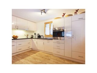 In the open plan living area, with kitchen, dining
