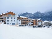 Appartementanlage Alpine Living - Hausfoto Winter