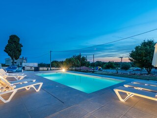 The pool illuminates for night swimming