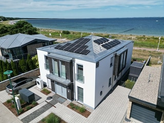 Ansicht Haus mit Strand