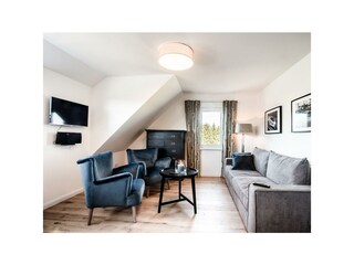 Wohnung 6: Wohnzimmer Ansicht 2