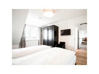 Wohnung 6: Schlafzimmer 1 Ansicht 1