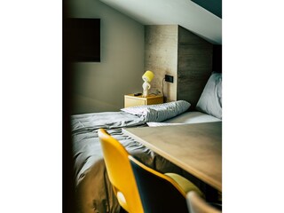Söll_AparthotelOldSchool_Schlafzimmer_WilderKaiser