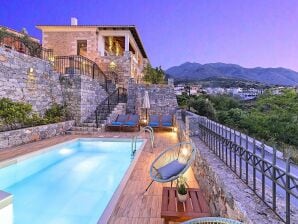 Maison de vacances sur la pente, construite en pierre et bois, vue, piscine privée - Georgioupolis - image1
