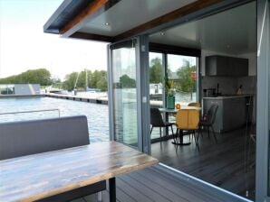 Huisboot Moderne woonboot in Volendam met een gedeeld zwembad - Katwoude - image1