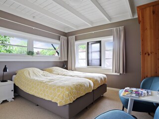 Schlafzimmer mit Sitzecke