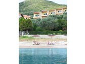 The private beach in front of The Yellow Houses