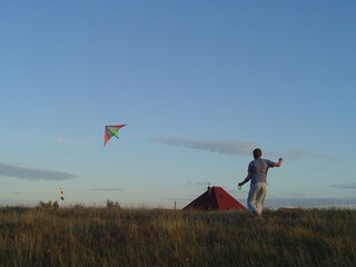 flying kites on the dike