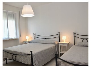 Double bedroom with extra bed