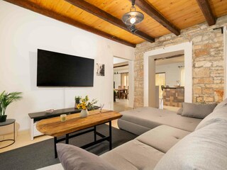 Living room with SMART 65" TV - Netflix & Prime Video