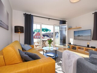 Wohnzimmer mit TV Flat und Musikanlage