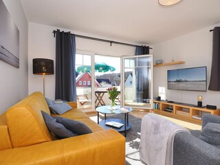 Wohnzimmer mit TV Flat und Musikanlage