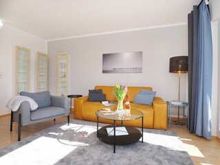 Wohnzimmer mit Ausziehcouch für optionale Aufbettung