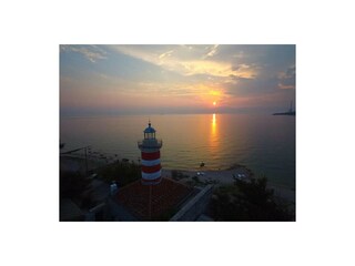 Sunset in Kraljevica nad lighthouse 100 old