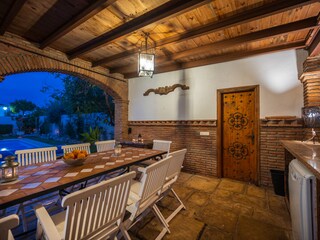 Terrace with spacious dining table with pool view