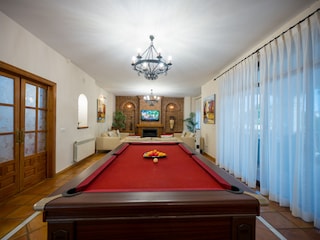 Pool table in the living room for entertainment