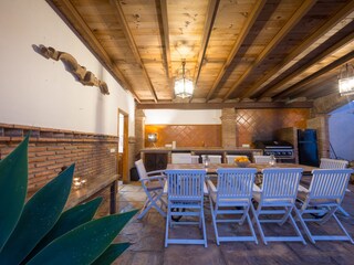 Pool views from terrace with dining table for 8