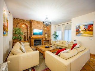 Comfortable sofas in lounge area with wooden table