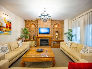 Wooden coffee table and comfortable sofas