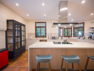 Modern bar stools in open plan kitchen
