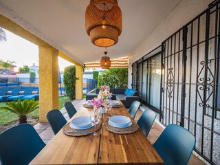Dining table for 8 on terrace with pool views