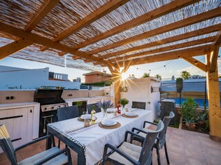 Outdoor area with gas BBQ and dining table for 8