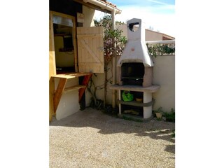 barbecue with little kitchenette outside