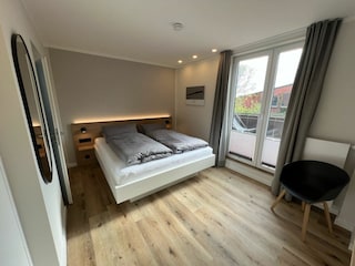 Schlafzimmer mit Balkon
