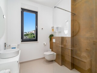 En-suite bathroom with a shower.