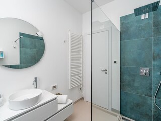 En-suite bathroom with a shower.