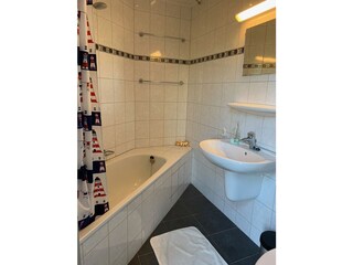 Bathroom with bath and shower