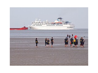 Beach life with ships in Otterndorf