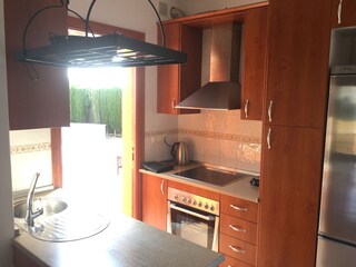 Well-stocked kitchen with everything you might need.