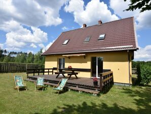 Ferienhaus Vakantiehuis aan meer met boot in Polen