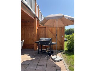 überdachte Terrasse mit grill