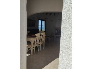 entry to the house, left dining area, right kitchen
