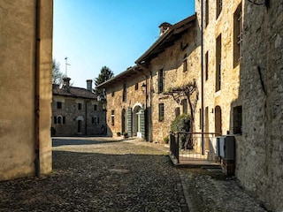 Part of the castle's "borgo". Behind the church